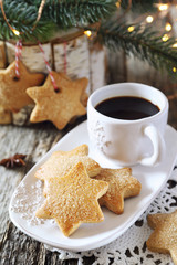 New Year composition: cup of coffee and Christmas cinnamon cookies
