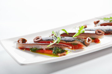 Sardines with tomatoes and kalamata olives