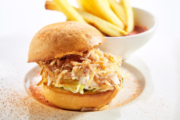 Burger with crab meat and french fries closeup