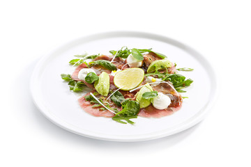 Tuna carpaccio with avocado and lime close up