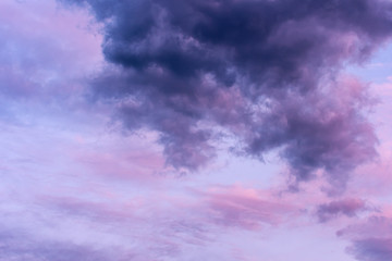 Fototapeta na wymiar Blue hour sky clouds background. Beautiful landscape with stormy clouds and purple sun on sky