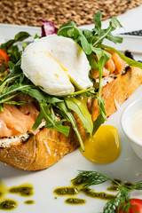 sandwich with salted salmon and poached egg