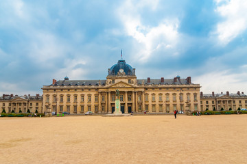 Great panoramic view of the École Militaire (military school) in Paris at the opposite end of the Champ-de-Mars park on a cloudy day. Today it houses a training school for French army officers. 