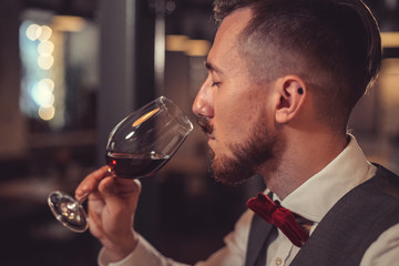 Young man drinking wine