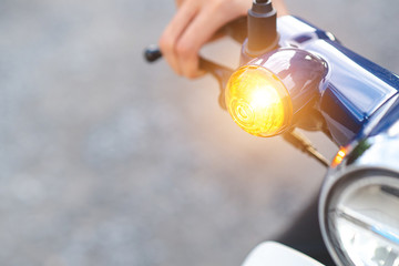 Close up of turn signal of the motorcycle. Conveys safety on the road.