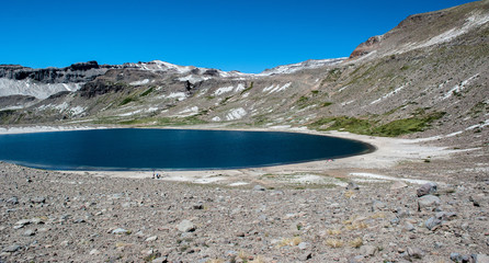 Laguna Animas in unique white sand desert mountains in Patagonia, Chile. Sunny sky, active...