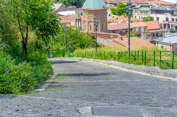 Beautiful stone path for descent from hills, mountains on a Sunny day, Tbilisi
