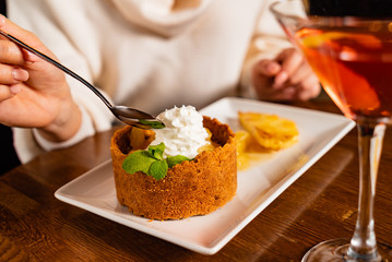 woman eating dessert with pineapple
