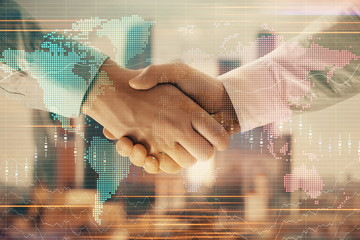 Double exposure of financial chart and world map on cityscape background with two businessmen handshake. Concept of international investment