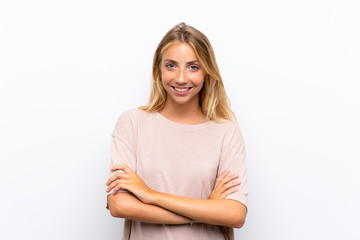 Fototapeta premium Blonde young woman over isolated white background laughing
