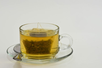 Tea and  Green Tea bag in glass cup is ready to drink