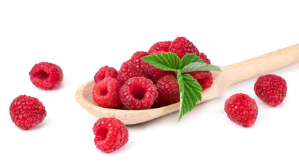 .raspberries in a spoon on a white background