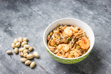 Fototapeta premium Shrimps with soba noodles and shrimps - asian food creative concept.