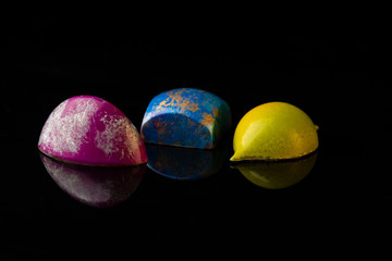 Chocolate candies collection on black background