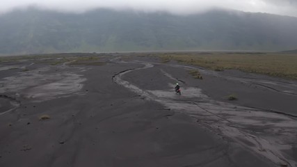 Motorcyclist and landscape of mountains
