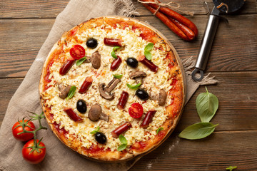 Whole pizza with mushrooms top view