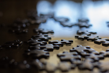 puzzle pieces on glass table close up