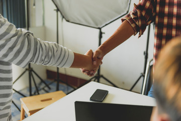 Business partnership handshake concept.Photo two coworkers handshaking process.Successful deal after great meeting.