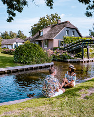 Giethoorn Netherlands, iew of typical houses of Giethoorn. The beautiful houses and gardening city is know as "Venice of the North".