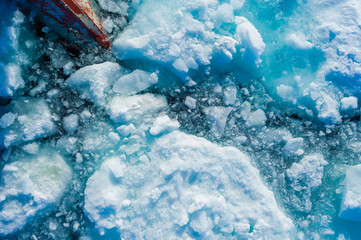 Bow of ice breaker going through ice in the Arctic Circle.