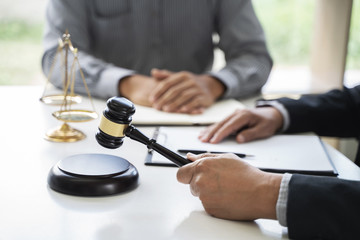 Justice lawyer consulting give a advice with client in courtroom.