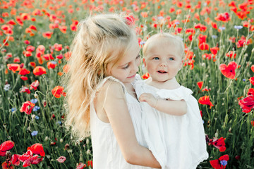 girl looks at her little sister