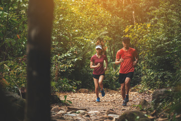 Runners. Young people  trail running on a mountain path. Adventure trail running on a mountain....