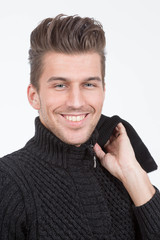 young handsome smiling man in black sweater