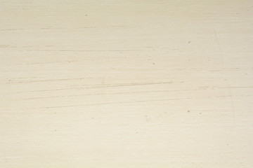 Texture of scratches on cream wood material, abstract background. Scratched cream wood surface background.