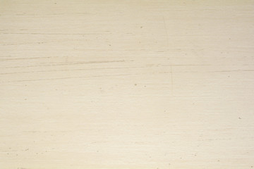 Scratched cream wood surface background. Wood grain pattern texture background in light cream beige color tone.