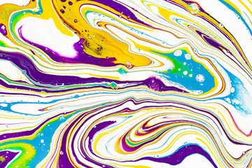 Acrylic paint waves abstract background. Rainbow marble texture. Oil paint liquid flow colorful wallpaper. Creative violet, yellow, blue fluid effect backdrop.