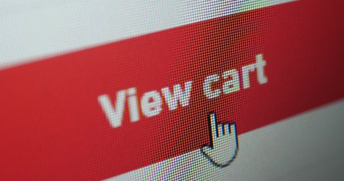 Closeup of mouse cursors click at add to cart button on led computer screen