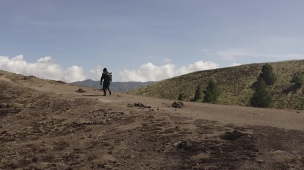 Tourist in beautiful mountain landscape