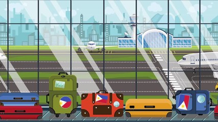 Suitcases with Philippines flag stickers on baggage carousel in airport. Tourism related loopable cartoon animation