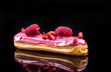French Artisan Eclair on Black Reflective Background,Copy Space