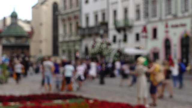 Crowds of people on the streets of the city. Time lapse. Out of focus.