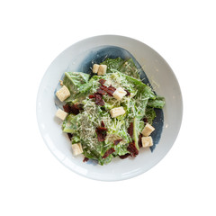 Top view isolated organic caecar salad in white dish. International food with clipping path