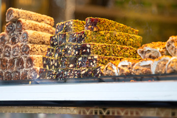 Traditional delicious turkish desserts in the shop window showcase. Different kinds of turkish delights. Popular souvenirs and snacks from Turkey.