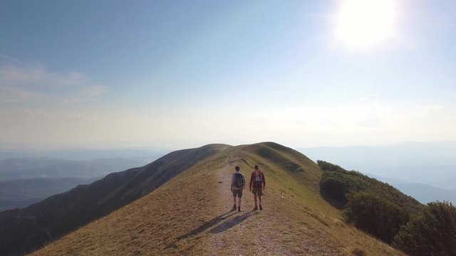 Drone view of two friends hiking in the Apennines, Umbria, Italy