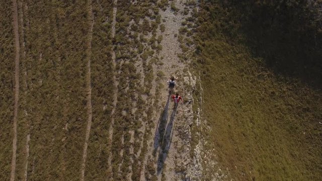 Drone view of two friends hiking in the Apennines, Umbria, Italy