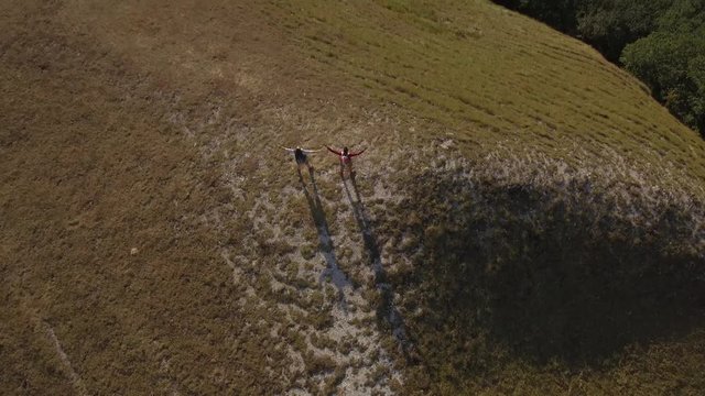 Drone view of two friends hiking in the Apennines, Umbria, Italy