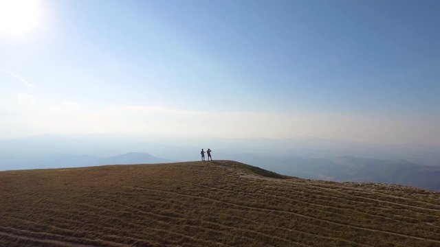 Drone view of two friends hiking in the Apennines, Umbria, Italy