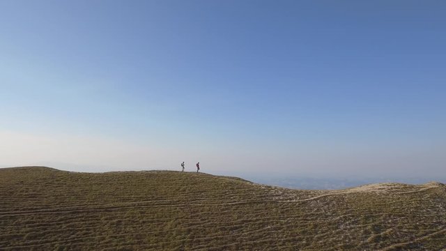 Drone view of two friends hiking in the Apennines, Umbria, Italy