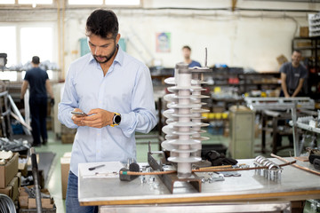 The engineer oversees the process of working in an electrical workshop,stock photo