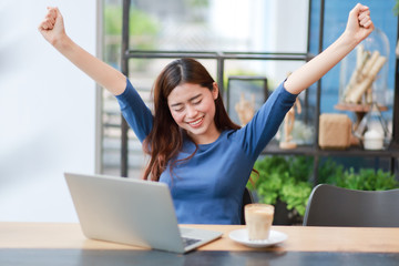 Asian business girl working and drinking coffee in cafe