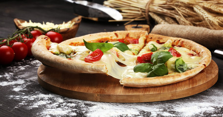 vegetarian italian Pizza with tomatoes, mozzarella cheese  and basil. Delicious italian pizza