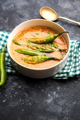 Hyderabadi mirch/mirchi ka Salan or green chilly sabzi or curry. Main course recipe from India. served in a bowl. selective focus