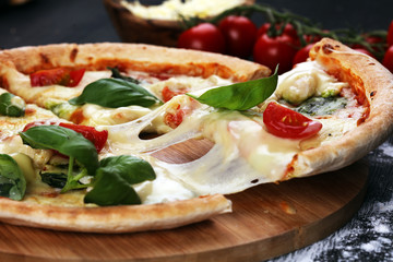 vegetarian italian Pizza with tomatoes, mozzarella cheese  and basil. Delicious italian pizza
