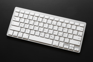 typical computer keyboard isolated on black background