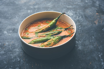 Hyderabadi mirch/mirchi ka Salan or green chilly sabzi or curry. Main course recipe from India. served in a bowl. selective focus